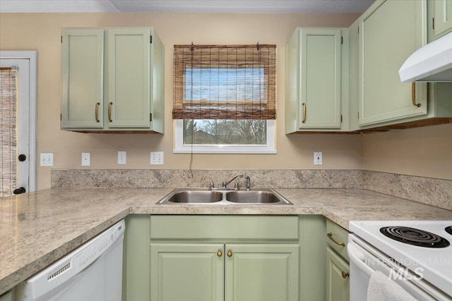 kitchen with sink, white appliances, and green cabinets