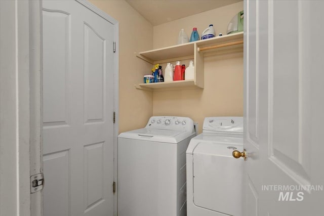 washroom with separate washer and dryer