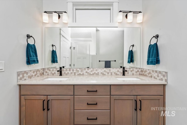 bathroom with vanity and backsplash