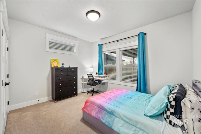 carpeted bedroom with a textured ceiling