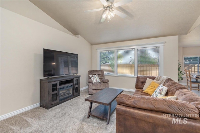 6229 S Snowdrop Way, Boise, ID 83716 - living area with light colored carpet, a ceiling fan, baseboards, and lofted ceiling