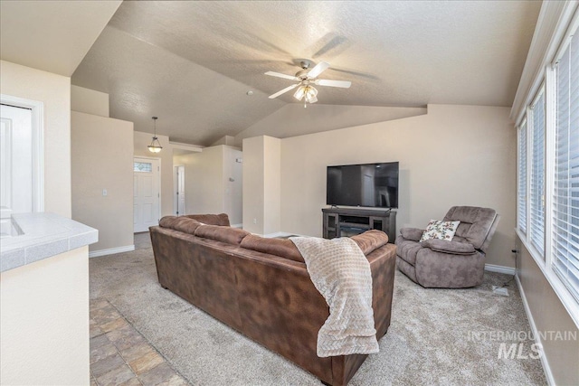 6229 S Snowdrop Way, Boise, ID 83716 - living area with a ceiling fan, baseboards, lofted ceiling, and light colored carpet