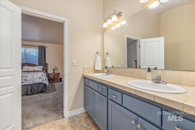 6229 S Snowdrop Way, Boise, ID 83716 - ensuite bathroom with double vanity and baseboards