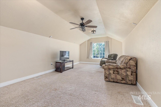 6229 S Snowdrop Way, Boise, ID 83716 - living area with carpet flooring, lofted ceiling, ceiling fan, baseboards, and a textured ceiling