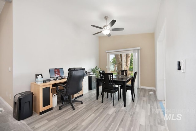 office featuring ceiling fan, lofted ceiling, and light hardwood / wood-style floors