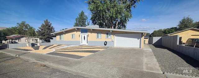 ranch-style house featuring a garage