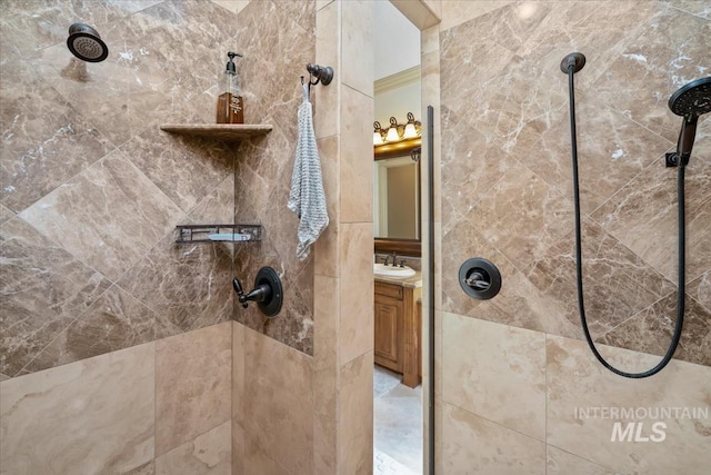 interior space with tiled shower and vanity