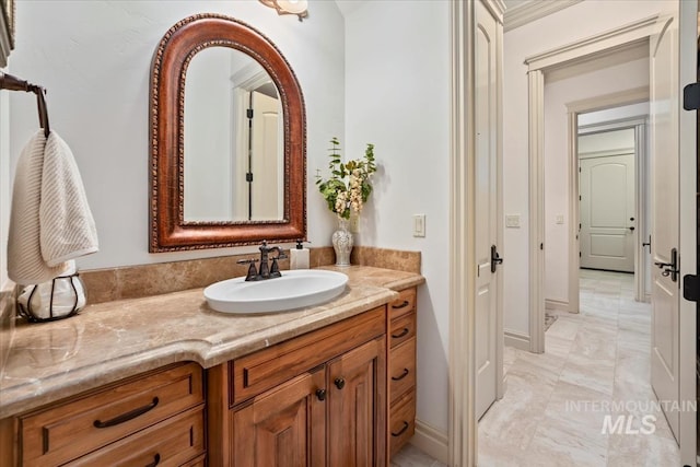 bathroom with vanity and marble finish floor