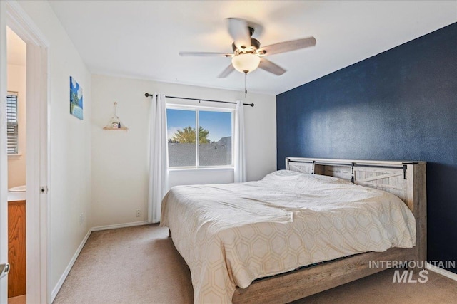 carpeted bedroom with baseboards and a ceiling fan