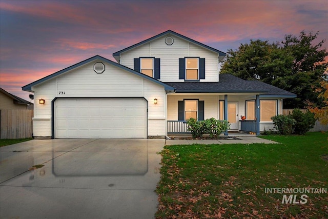 traditional-style house with fence, an attached garage, covered porch, a yard, and driveway