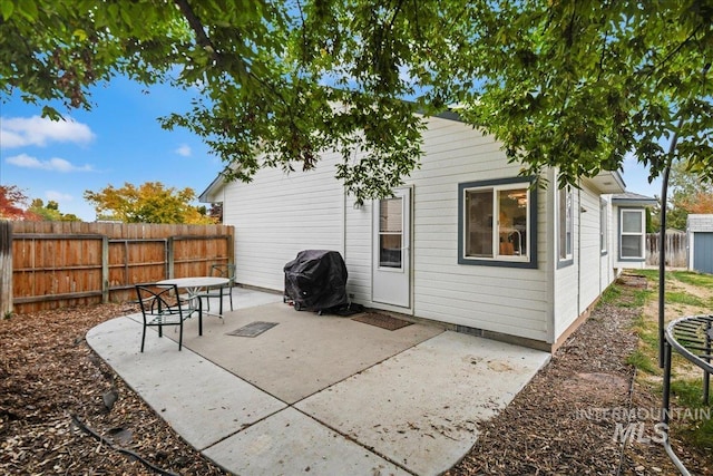 back of property with a patio