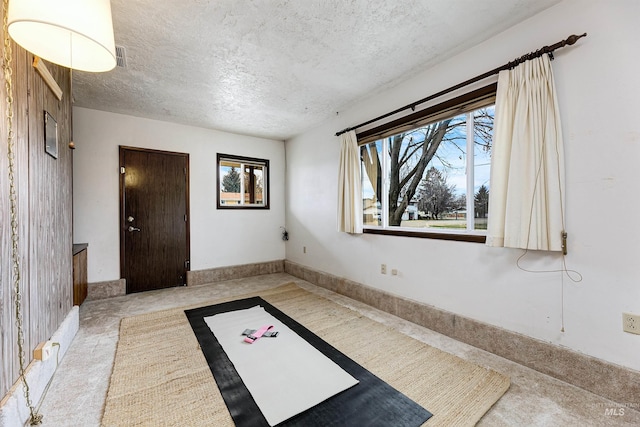 interior space featuring a textured ceiling