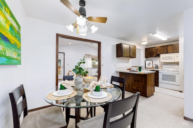 dining space with a ceiling fan