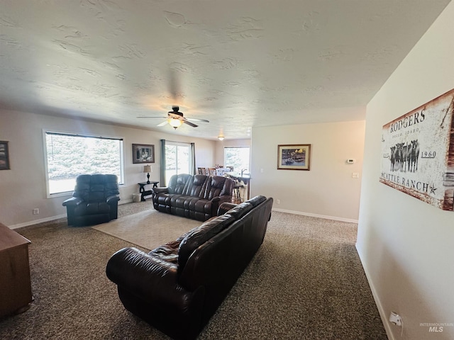 382 N 1020 E, Declo, ID 83323 - living room featuring baseboards, carpet flooring, and ceiling fan