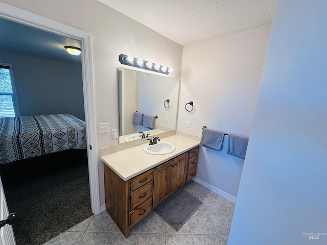 382 N 1020 E, Declo, ID 83323 - bathroom featuring a textured ceiling, baseboards, tile patterned flooring, and vanity
