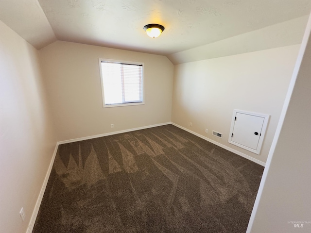 382 N 1020 E, Declo, ID 83323 - interior space with lofted ceiling, dark colored carpet, baseboards, and visible vents