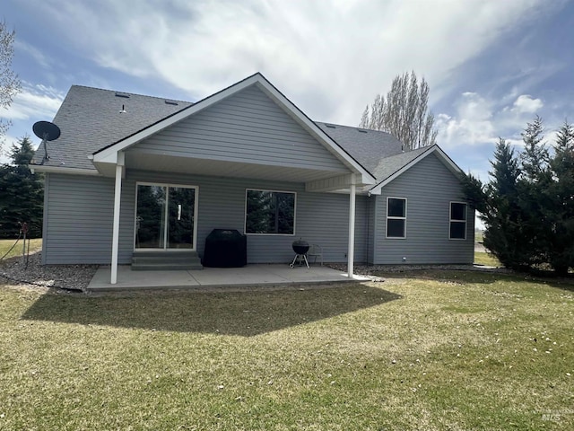 382 N 1020 E, Declo, ID 83323 - rear view of house featuring a lawn, a patio, and a shingled roof