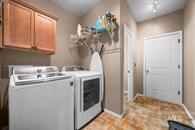 3856 Wood Way, New Plymouth, ID 83655 - washroom featuring cabinet space, baseboards, washing machine and dryer, and stone finish floor