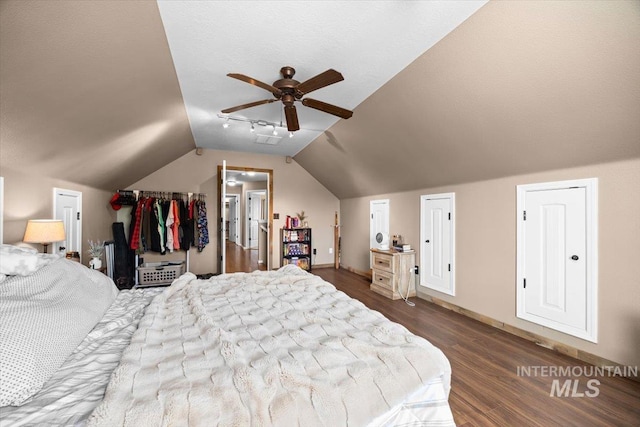 3856 Wood Way, New Plymouth, ID 83655 - bedroom with baseboards, a ceiling fan, vaulted ceiling, and dark wood-type flooring