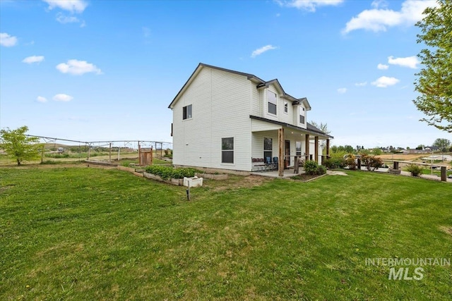 3856 Wood Way, New Plymouth, ID 83655 - rear view of property featuring a lawn, fence, and a patio area