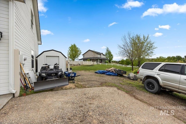 3856 Wood Way, New Plymouth, ID 83655 - view of yard featuring driveway, an outdoor structure, fence, and a shed