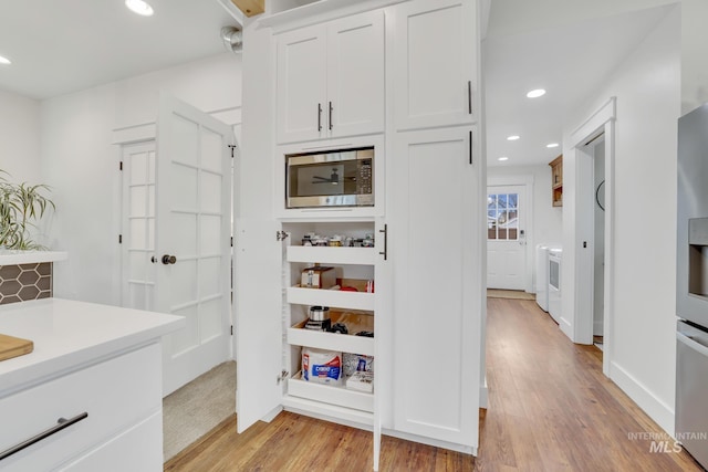 pantry featuring washer / clothes dryer