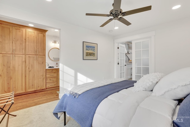 bedroom with light hardwood / wood-style floors and ceiling fan