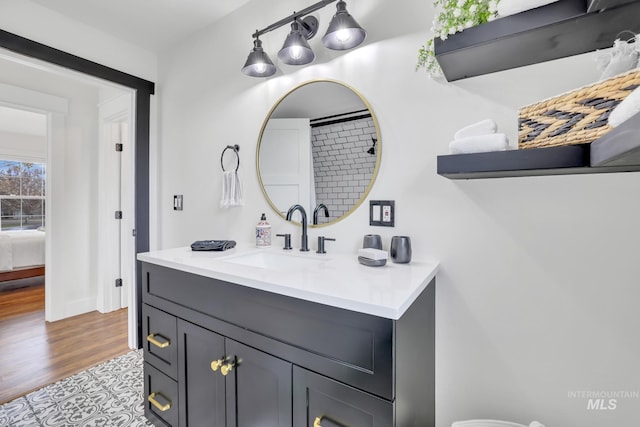 bathroom featuring vanity and wood-type flooring