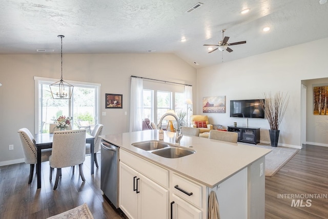 3772 S Walnut Ridge Way, Nampa, ID 83686 - kitchen with vaulted ceiling, dishwasher, dark wood-style floors, hanging light fixtures, and white cabinetry