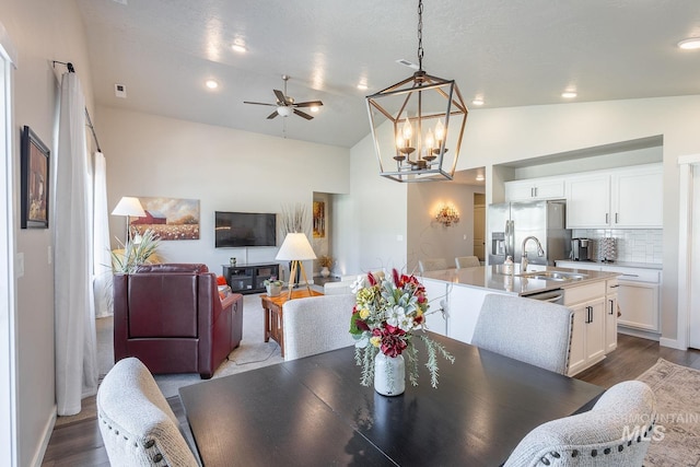 3772 S Walnut Ridge Way, Nampa, ID 83686 - dining space featuring ceiling fan, a chandelier, dark wood-type flooring, recessed lighting, and high vaulted ceiling