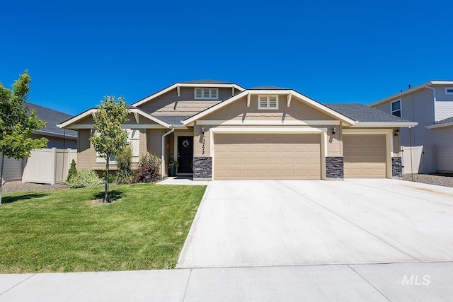 3772 S Walnut Ridge Way, Nampa, ID 83686 - craftsman house featuring an attached garage, stone siding, and concrete driveway