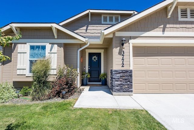 3772 S Walnut Ridge Way, Nampa, ID 83686 - view of front facade with stone siding and a garage