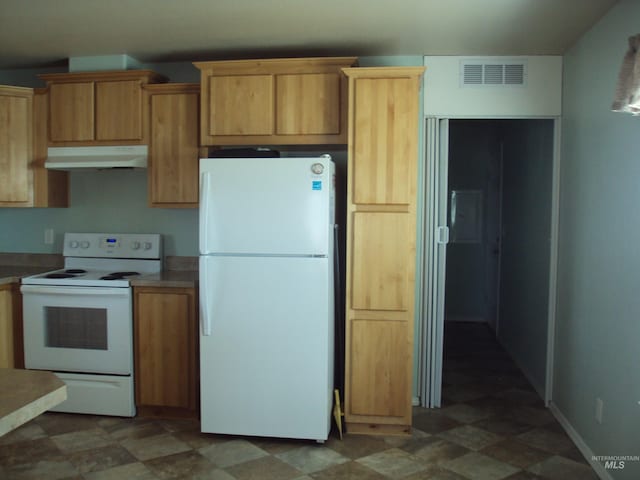 908 Pine St, Lewiston, ID 83501 - kitchen featuring white appliances, under cabinet range hood, tile patterned floors, baseboards, and light countertops