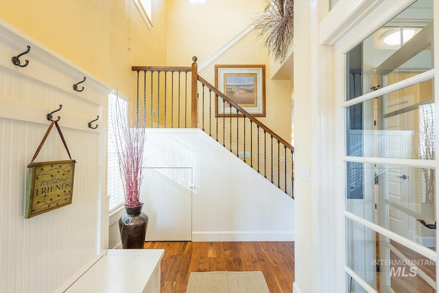 interior space with hardwood / wood-style floors and a high ceiling