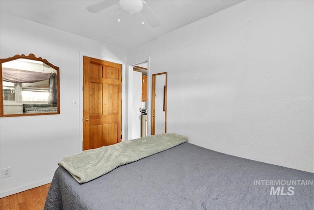 bedroom featuring wood finished floors and a ceiling fan