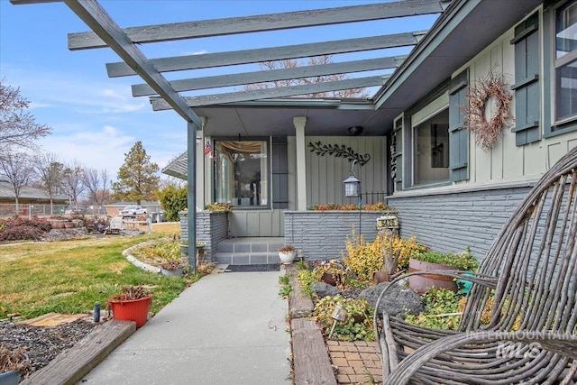 doorway to property featuring a pergola, a lawn, and board and batten siding