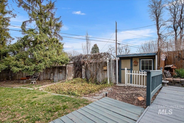 view of yard featuring a deck and a fenced backyard