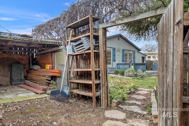 back of property featuring a deck