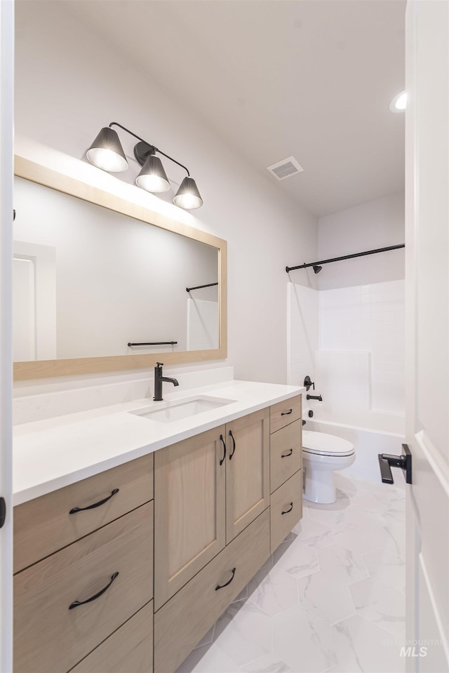 full bath with toilet, visible vents, vanity, marble finish floor, and shower / bathing tub combination