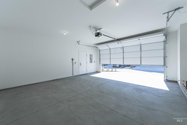 garage featuring electric panel and a garage door opener