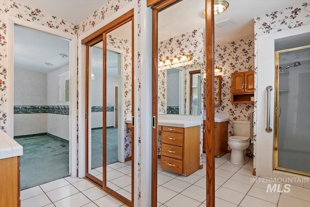 10809 W Cruser, Boise, ID 83709 - full bathroom featuring wallpapered walls, vanity, a shower stall, toilet, and tile patterned floors