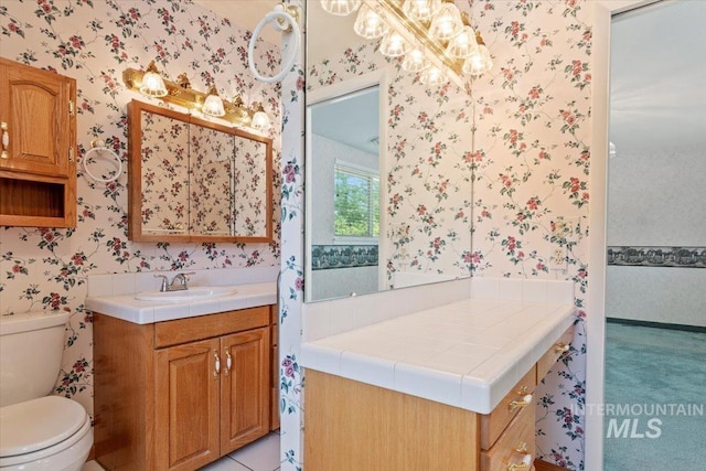 10809 W Cruser, Boise, ID 83709 - bathroom with wallpapered walls, vanity, and toilet