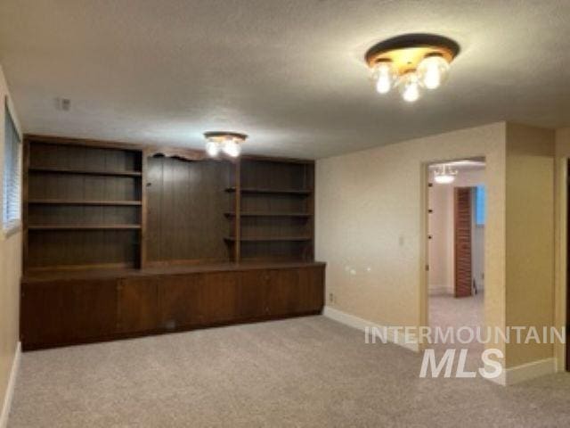 10809 W Cruser, Boise, ID 83709 - empty room with carpet flooring and baseboards