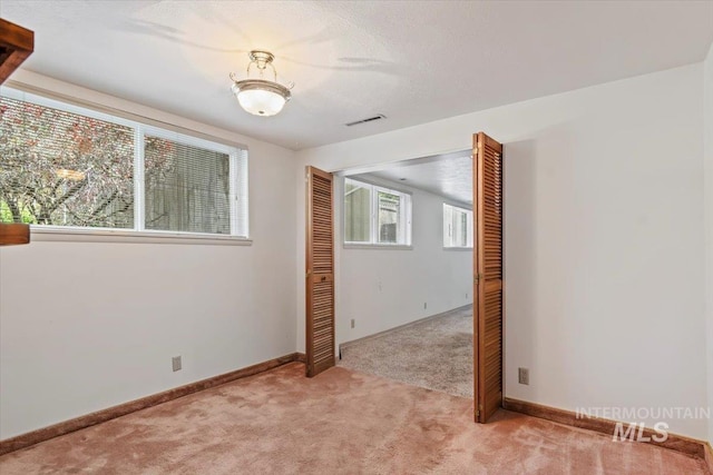 10809 W Cruser, Boise, ID 83709 - spare room featuring light carpet and baseboards