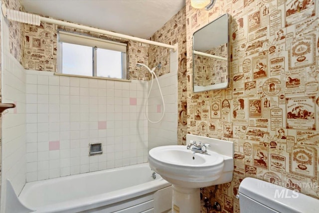 10809 W Cruser, Boise, ID 83709 - bathroom featuring wallpapered walls, toilet, and shower / bathtub combination