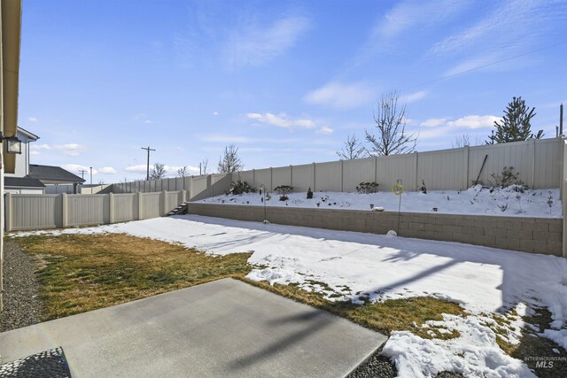 view of yard layered in snow