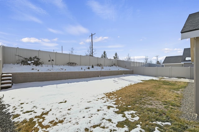 view of yard covered in snow