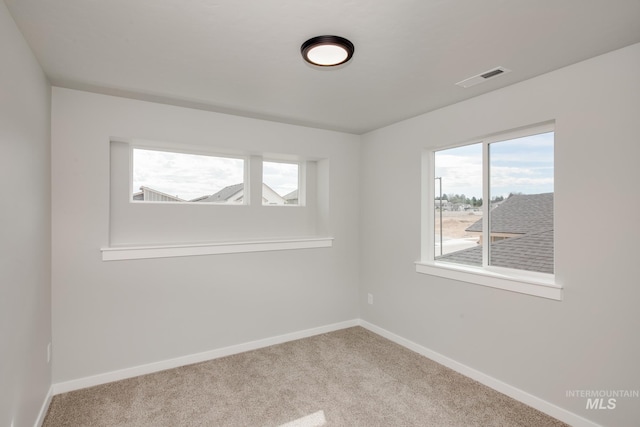 empty room with carpet flooring