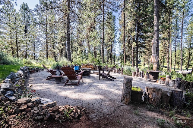 view of patio with a fire pit