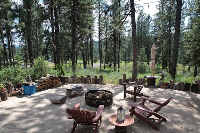 view of patio with an outdoor fire pit